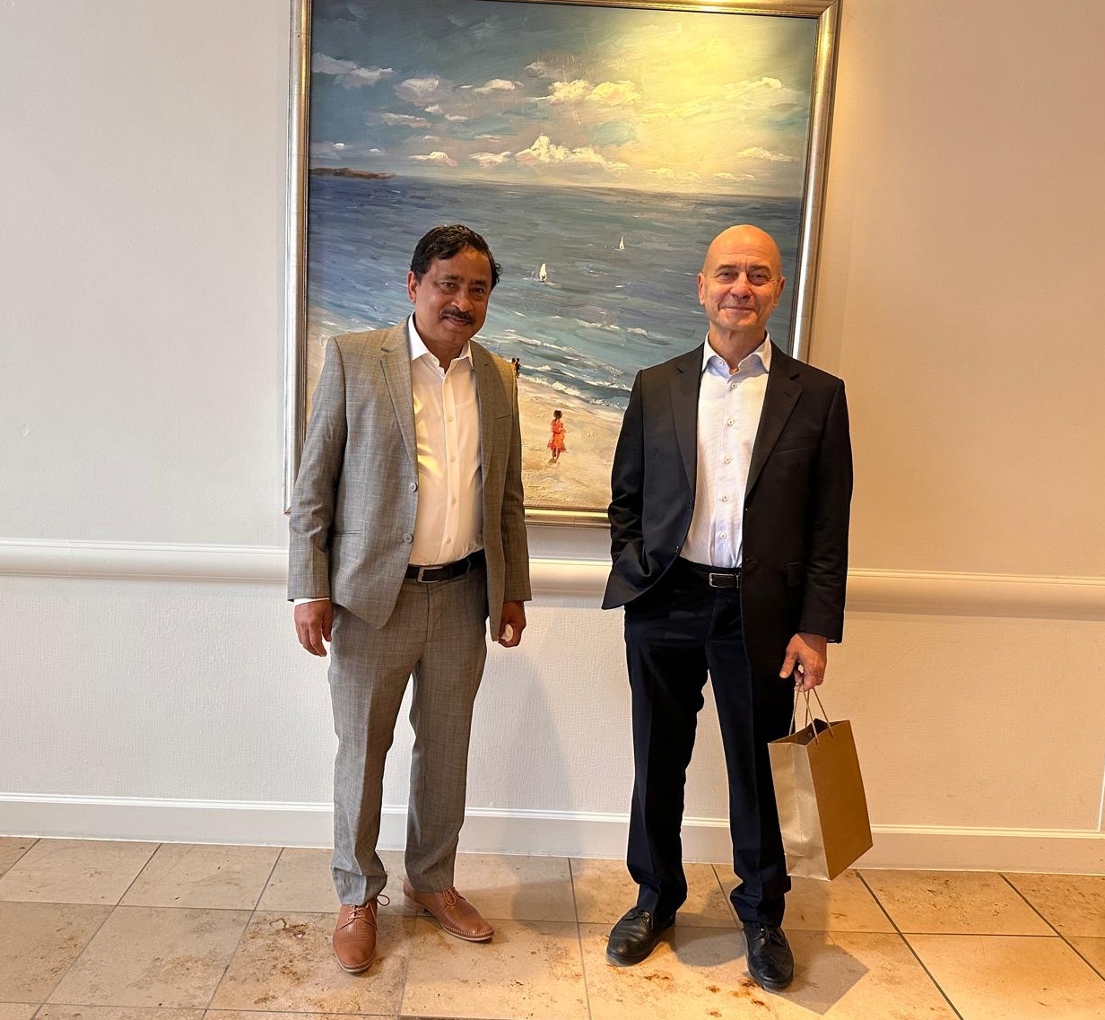 Ambassador Belal is seen with Ambassador Issa