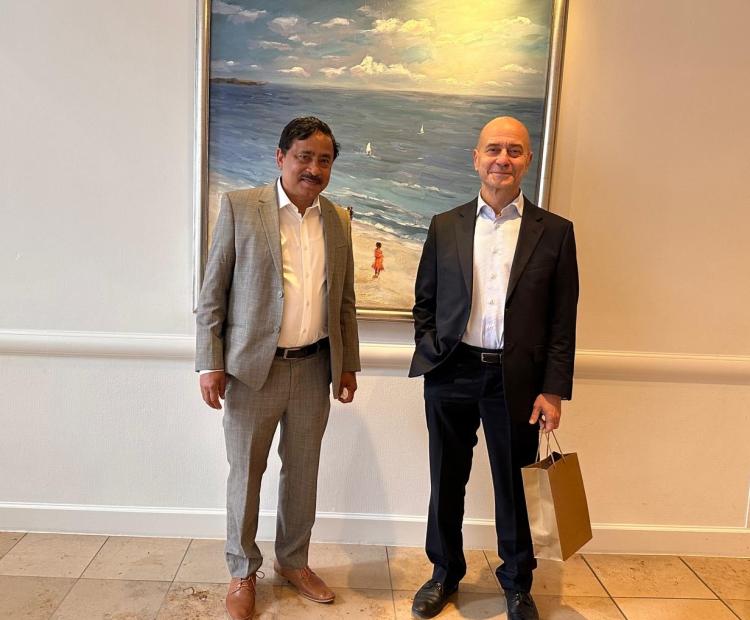 Ambassador Belal is seen with Ambassador Issa